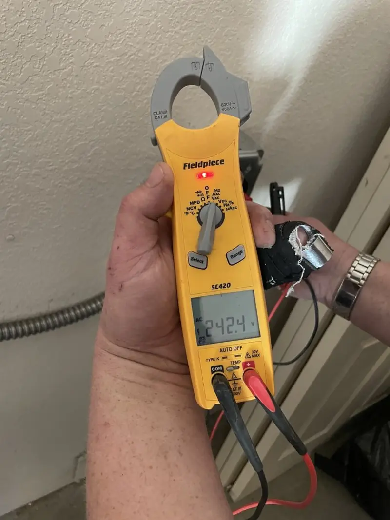 Voltage testing with clamp meter during Recessed Lighting Installation in El Dorado